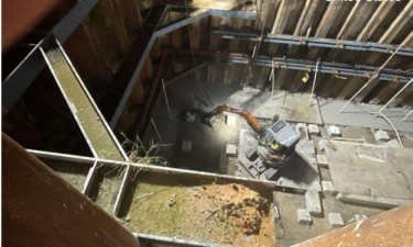 Excavating bottom of footer grade