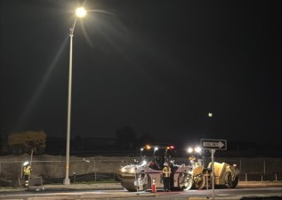 Crews are using two rolling machines to compact the new asphalt on U.S. 17 in Winter Haven during the early hours of March 26, 2026