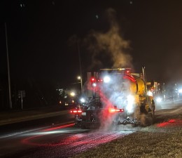 Machine Spreading Tack Before Paving on 01-21-26